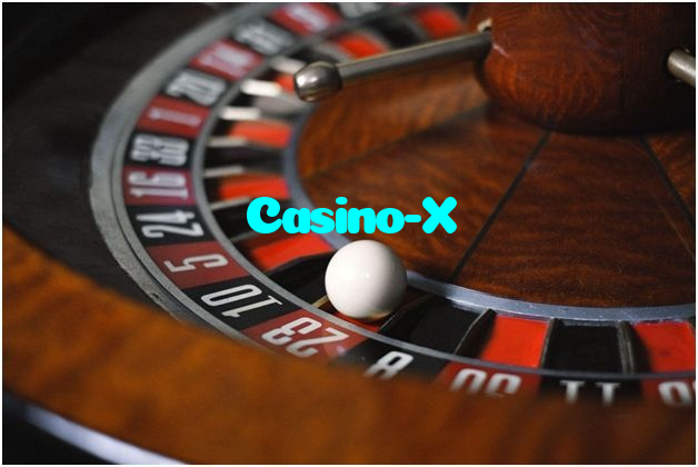 Casino-X casino presented on mobile device in Pakistan with slots and live games